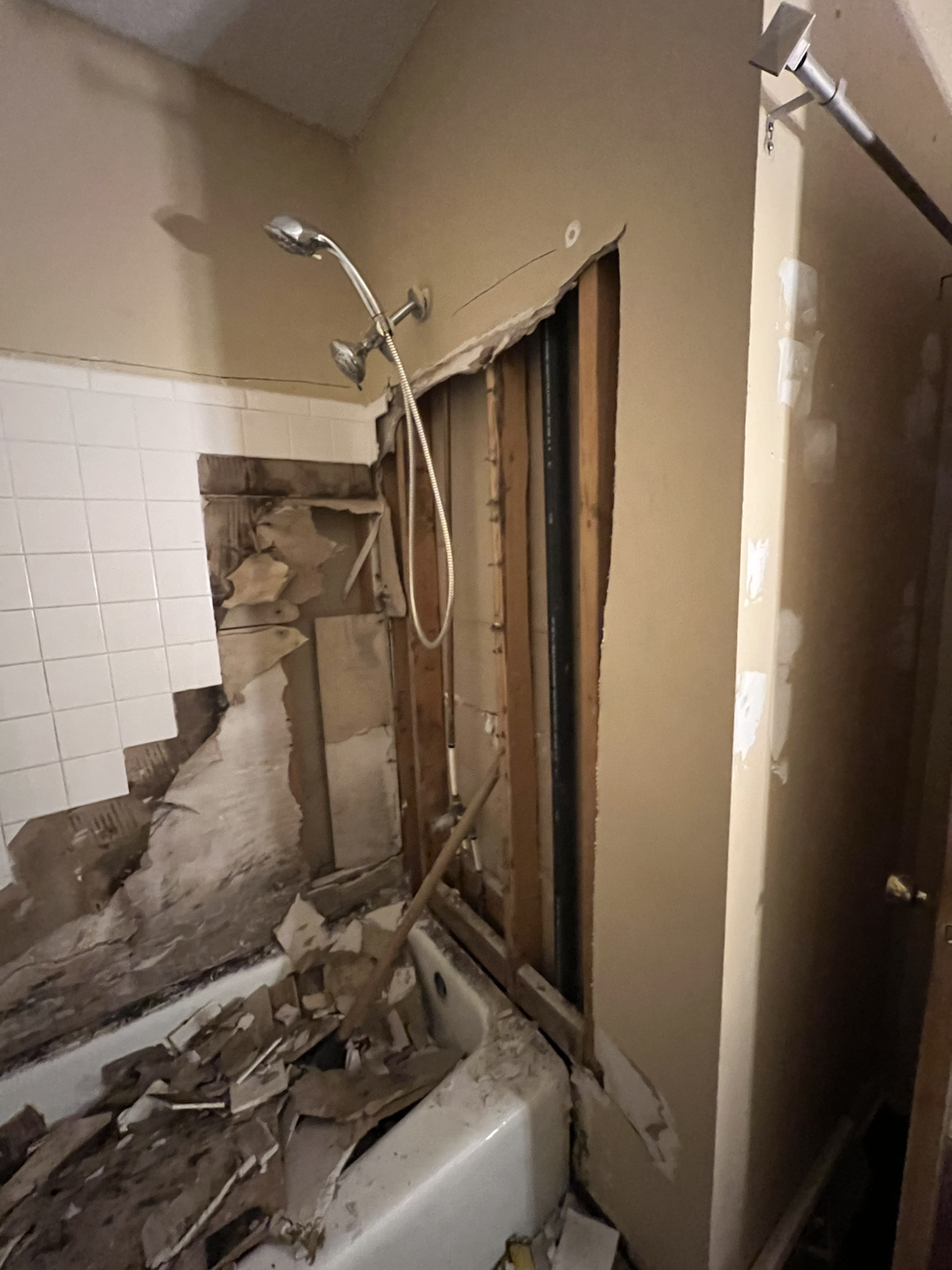 Bathroom demolition before shower remodel by Marco's Home Improvement & Remodeling